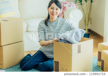 A woman preparing to move A woman preparing to move 119991710