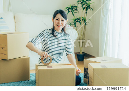 A woman preparing to move A woman preparing to move 119991714