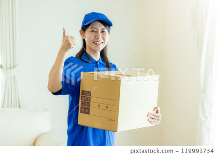 Woman preparing to move, moving company Woman preparing to move, moving company 119991734