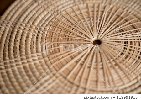 Close up to Round Circle woven straw mat Wicker pattern of local Thai handmade craft. 119991913