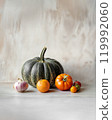 Natural still life with orange and green pumpkins, tomatoes and onions. Bright background with copy space. Thanksgiving, production for the market, harvest concept 119992060