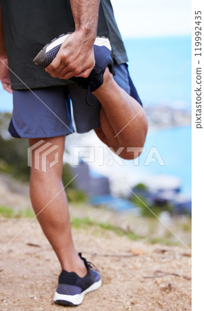 Fitness, legs and man stretching by nature before workout or morning training routine for race or wellness. Person, runner and outdoor with exercise for warm up for marathon, cardio and health. 119992435