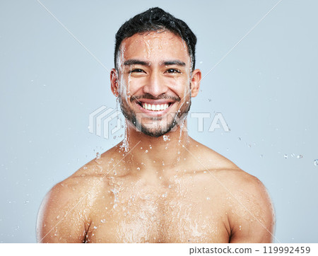 Man, shower and water on body for cleaning, skincare and wash on white studio background with smile. Male person, portrait and hygiene with clear liquid for facial, wellness and self care in bathroom Man, shower and water on body for cleaning, skincare and wash on white studio background with smile. Male person, portrait and hygiene with clear liquid for facial, wellness and self care in bathroom 119992459