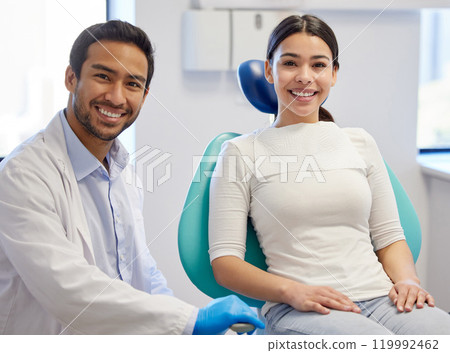 Portrait, dentist and patient in clinic for consultation, oral hygiene or medical procedure. Service, examination and doctor man with happy client for teeth whitening, orthodontics or dental care Portrait, dentist and patient in clinic for consultation, oral hygiene or medical procedure. Service, examination and doctor man with happy client for teeth whitening, orthodontics or dental care 119992462