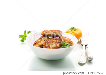 fried chicken cutlets in a bowl, isolated on white background fried chicken cutlets in a bowl, isolated on white background 119992532