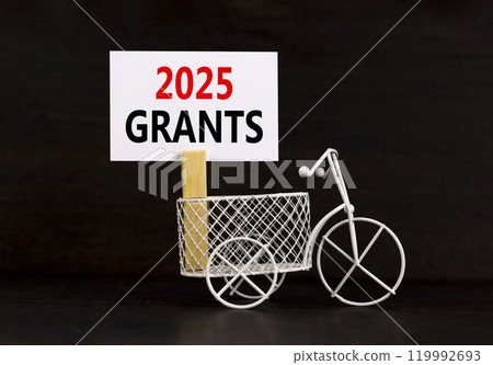 Planning 2025 grants new year symbol. Concept words 2025 Grants on beautiful white paper on wooden clothespin. Bicycle. Beautiful black background. Business 2025 grants new year concept. Copy space. 119992693