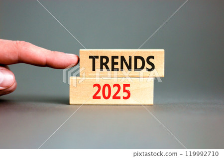 Planning trends 2025 new year symbol. Concept words Trends 2025 on beautiful wooden blocks. Beautiful grey background. Businessman hand. Business trends 2025 new year concept. Copy space. Planning trends 2025 new year symbol. Concept words Trends 2025 on beautiful wooden blocks. Beautiful grey background. Businessman hand. Business trends 2025 new year concept. Copy space. 119992710