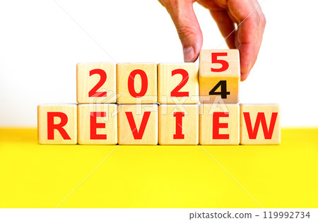 Planning 2025 review new year symbol. Concept words 2024 Review to 2025 Review on beautiful wooden blocks. Beautiful yellow table white background. Business 2025 review new year concept. Copy space. 119992734