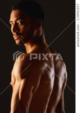 Back, fitness and portrait of man with muscles in studio for workout, sports and wellness or training. Bodybuilder, athlete and male person for progress and results by black background with pride 119992857