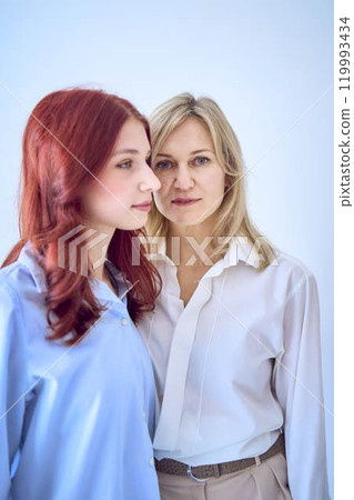 portrait of mother and daughter close up 119993434