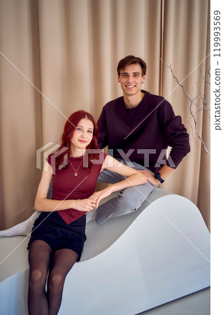 siblings, young brother and teenage sister posing together, studio photo shoot siblings, young brother and teenage sister posing together, studio photo shoot 119993569