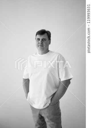 portrait of a middle-aged man on a white background portrait of a middle-aged man on a white background 119993631