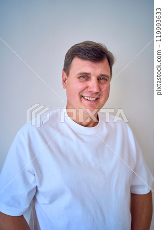 portrait of a middle-aged man on a white background portrait of a middle-aged man on a white background 119993633