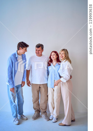 a family, middle-aged husband and wife, young adult son and teenage daughter, on a white background, studio photo shoot a family, middle-aged husband and wife, young adult son and teenage daughter, on a white background, studio photo shoot 119993638