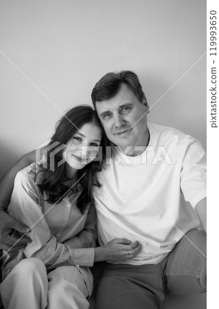 middle-aged father and teenage daughter hug middle-aged father and teenage daughter hug 119993650