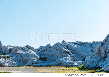 The striking white rocks make the scenery look like a snowy landscape. 119993950