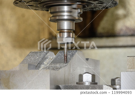 The CNC milling machine cutting press die part by solid bull nose end mill tool and G-code data background. 119994093