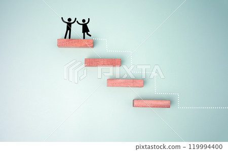 Wooden block stacking as step stair with red paper plane on blue background, Ladder of success in business growth concept. 119994400