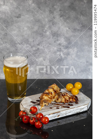 Chicken pieces on skewers with cherry tomatoes on a wooden board. Shashlik. 119995474