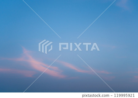Blue Sky with Light Pink Clouds. Abstract Texture Background Evening Blue Sky with Light Pink Clouds. Abstract Texture Background Evening 119995921