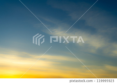 Blue and Golden Sky with Colorful Light Pink Cirrus Clouds at Sunset Wallpaper Texture Background Blue and Golden Sky with Colorful Light Pink Cirrus Clouds at Sunset Wallpaper Texture Background 119995923