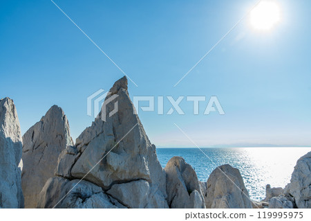 Rocks and sea in the sun 119995975