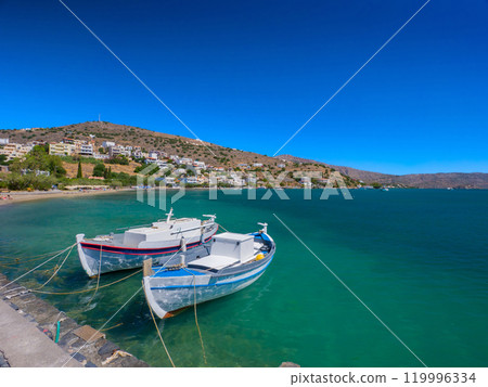 Boats moored on a turquoise beach (Elounda, Crete, Greece) Boats moored on a turquoise beach (Elounda, Crete, Greece) 119996334