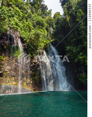 Rainbow over green plunge pool. Tinago Falls. Lanao del Norte. Philippines. Rainbow over green plunge pool. Tinago Falls. Lanao del Norte. Philippines. 119996335