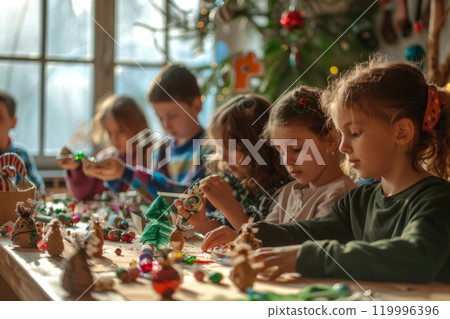 Children gathered around a table making handmade Christmas ornaments with colorful craft supplies 119996396