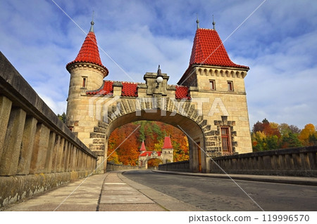 Beautiful old dam Les Kralovstvi - Czech Republic. Autumn background with colorful trees. Nature with landscape. Seasonal concept for fall. 119996570