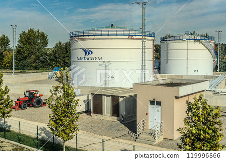 White fuel storage tank against blue sky. High quality photo 119996866