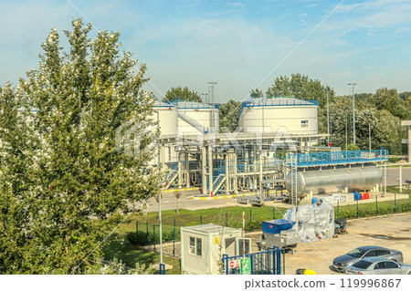 White fuel storage tank against blue sky. High quality photo 119996867
