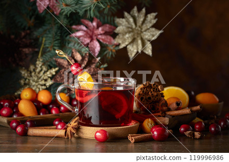 Cranberry drink with spices and citrus fruits. Cranberry drink with spices and citrus fruits. 119996986