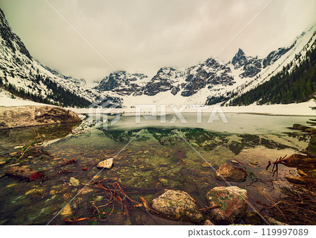 Frozen Lake Morskie Oko or Sea Eye Lake in Poland at Winter. Frozen Lake Morskie Oko or Sea Eye Lake in Poland at Winter. 119997089