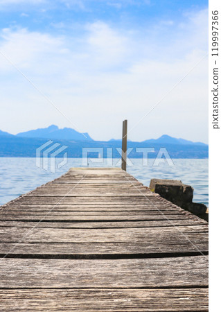 Wooden pier overlooking the Alps and Lake Geneva in Switzerland 119997366