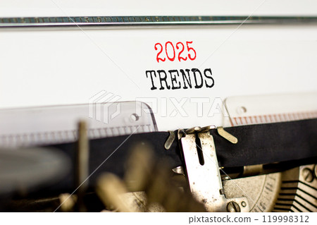 Planning 2025 trends new year symbol. Concept words 2025 Trends typed on beautiful old retro vintage typewriter. Beautiful white paper background. Business 2025 trends new year concept. Copy space. 119998312