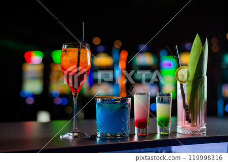 Cocktails set on a bar at Casino. Cocktails assortment. 119998316