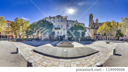 Historic square in Bastia's old town, Corsica, surrounded by buildings and trees under a blue sky in summer Historic square in Bastia's old town, Corsica, surrounded by buildings and trees under a blue sky in summer 119999086