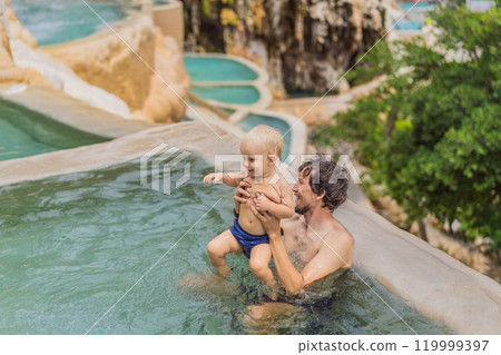 Father with his toddler son bathing in the hot springs of Grutas Tolantongo, Mexico. Family adventure, relaxation, and natural wellness concept Father with his toddler son bathing in the hot springs of Grutas Tolantongo, Mexico. Family adventure, relaxation, and natural wellness concept 119999397