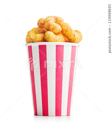 Puffed crispy Peanut flips in cup isolated on white background. 119999693