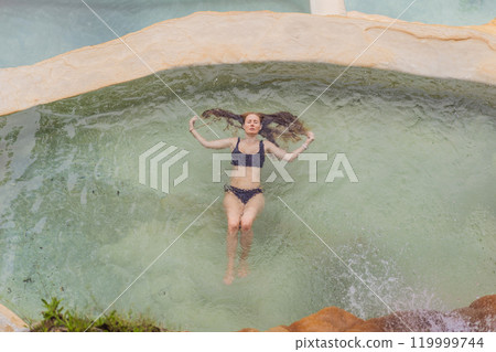 Female tourist at the hot springs of Grutas Tolantongo, Mexico. Adventure, relaxation, and natural wellness concept 119999744