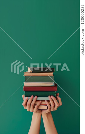 person hand holding stack of colorful books, study and education, intelligence and learning concept person hand holding stack of colorful books, study and education, intelligence and learning concept 120000282