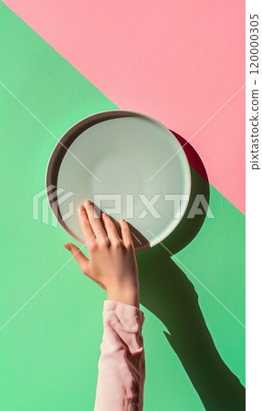 woman hand holding empty plate, in style of pink and green 120000305