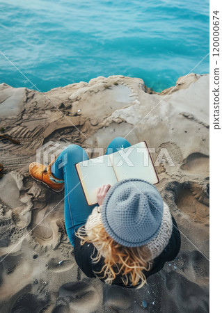 woman sitting with notebook on beach and writing memos in diary, person making notes in notepad, author writing book at sea coast woman sitting with notebook on beach and writing memos in diary, person making notes in notepad, author writing book at sea coast 120000674