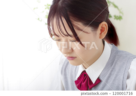 A high school girl studying with a serious expression A high school girl studying with a serious expression 120001716