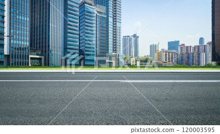 Empty asphalt road and city skyline at daytime 120003595