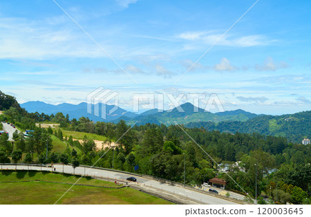Winding road leading through lush green mountains in malaysia Winding road leading through lush green mountains in malaysia 120003645