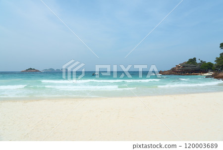 Turquoise water lapping on the white sand of a tropical beach Turquoise water lapping on the white sand of a tropical beach 120003689