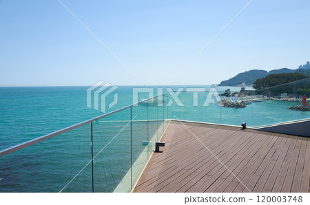 Serene seaside terrace with scenic ocean view Serene seaside terrace with scenic ocean view 120003748