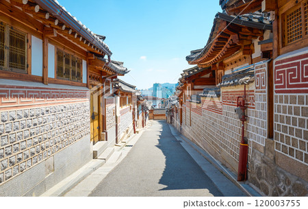 Narrow street leading up a hill with traditional korean houses in seoul Narrow street leading up a hill with traditional korean houses in seoul 120003755